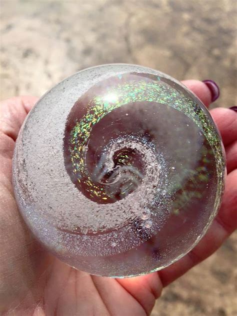 Cremation ashes swirled into glass prayer beads