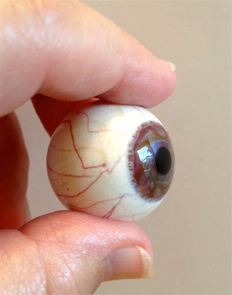 Prosthetic eye marble collection hidden in crayon boxes